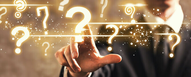 Guy tapping a question mark