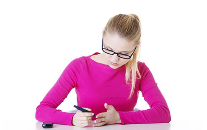 Teenager Checking Glucose