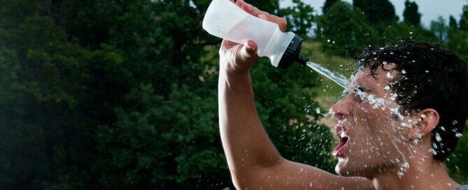 Guy Squirting Water in His Face