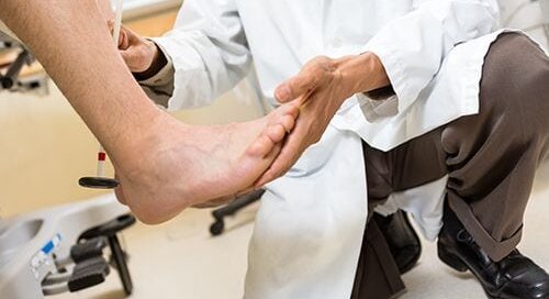 Doctors Looking at Patients Foot
