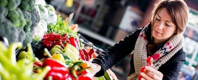 Woman picking out fresh vegetables