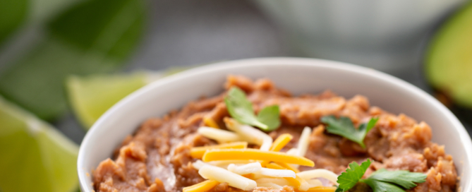 Refried beans in a white bowl