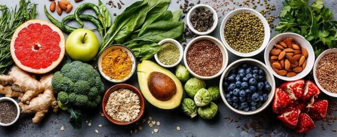 Summer fruit and vegetables on blackboard