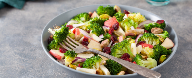 healthy broccoli salad with apple onion dried cranberries pistachio