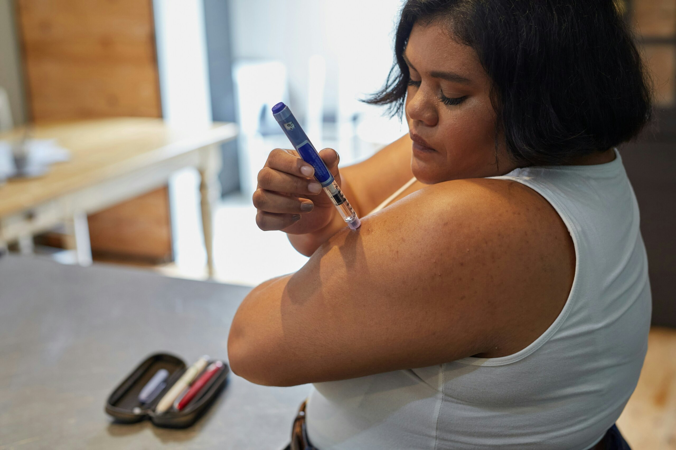 A woman taking insulin