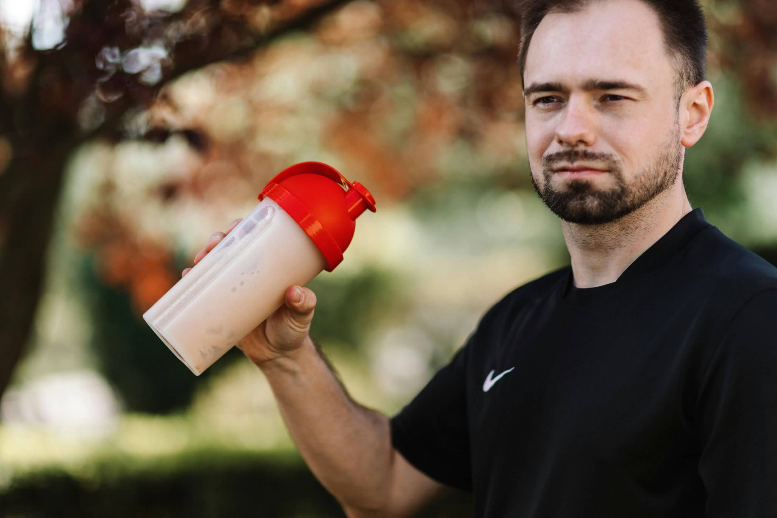A man holding a meal replacement shake