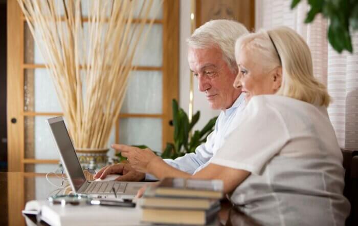 Older couple doing online shopping