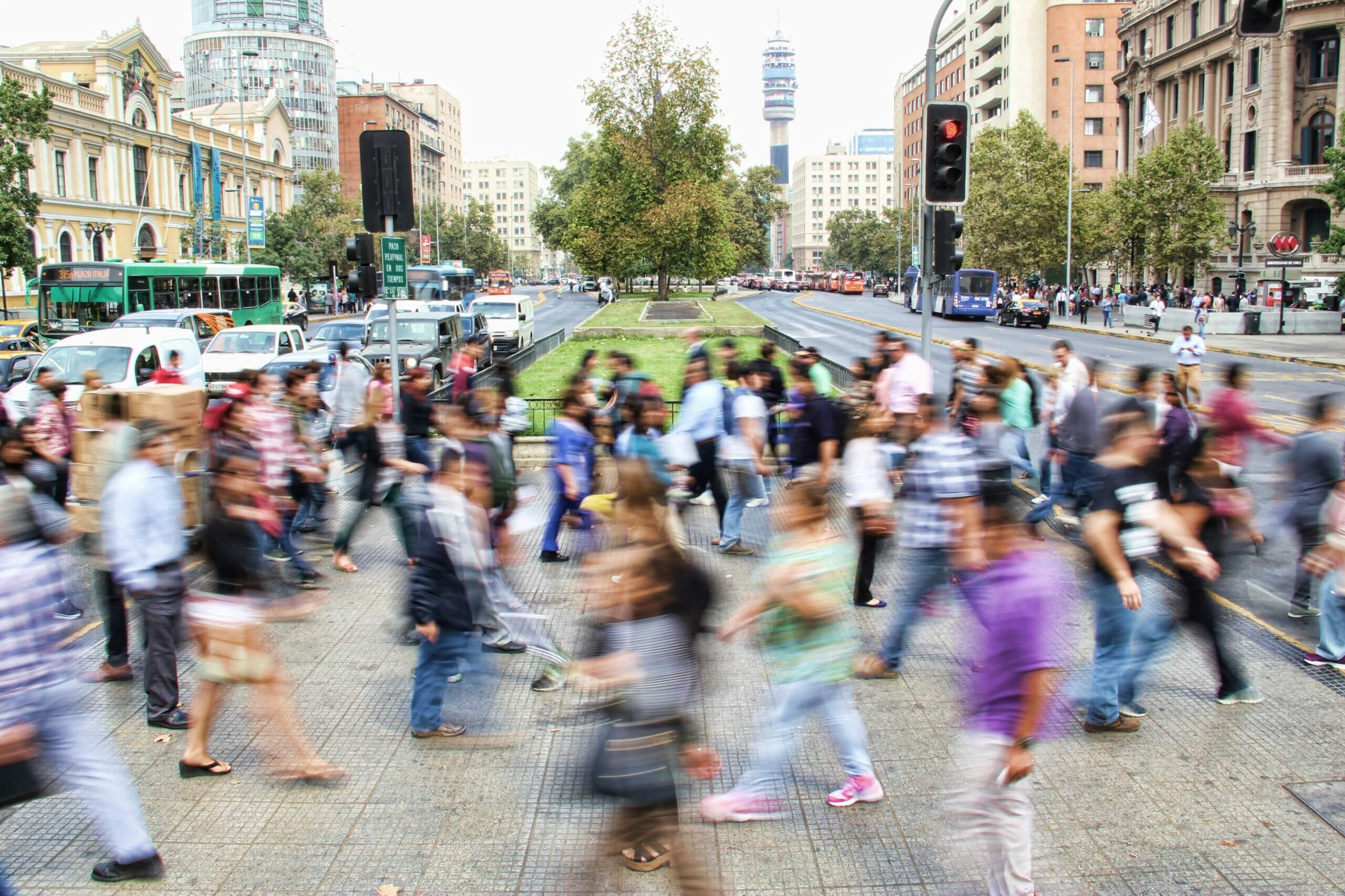 Timelapse photo of people walking in a busy city
