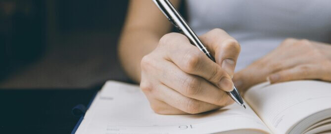 Woman writing in a notebook
